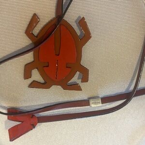 Beige and Red Crossbody Bag with Bug Design